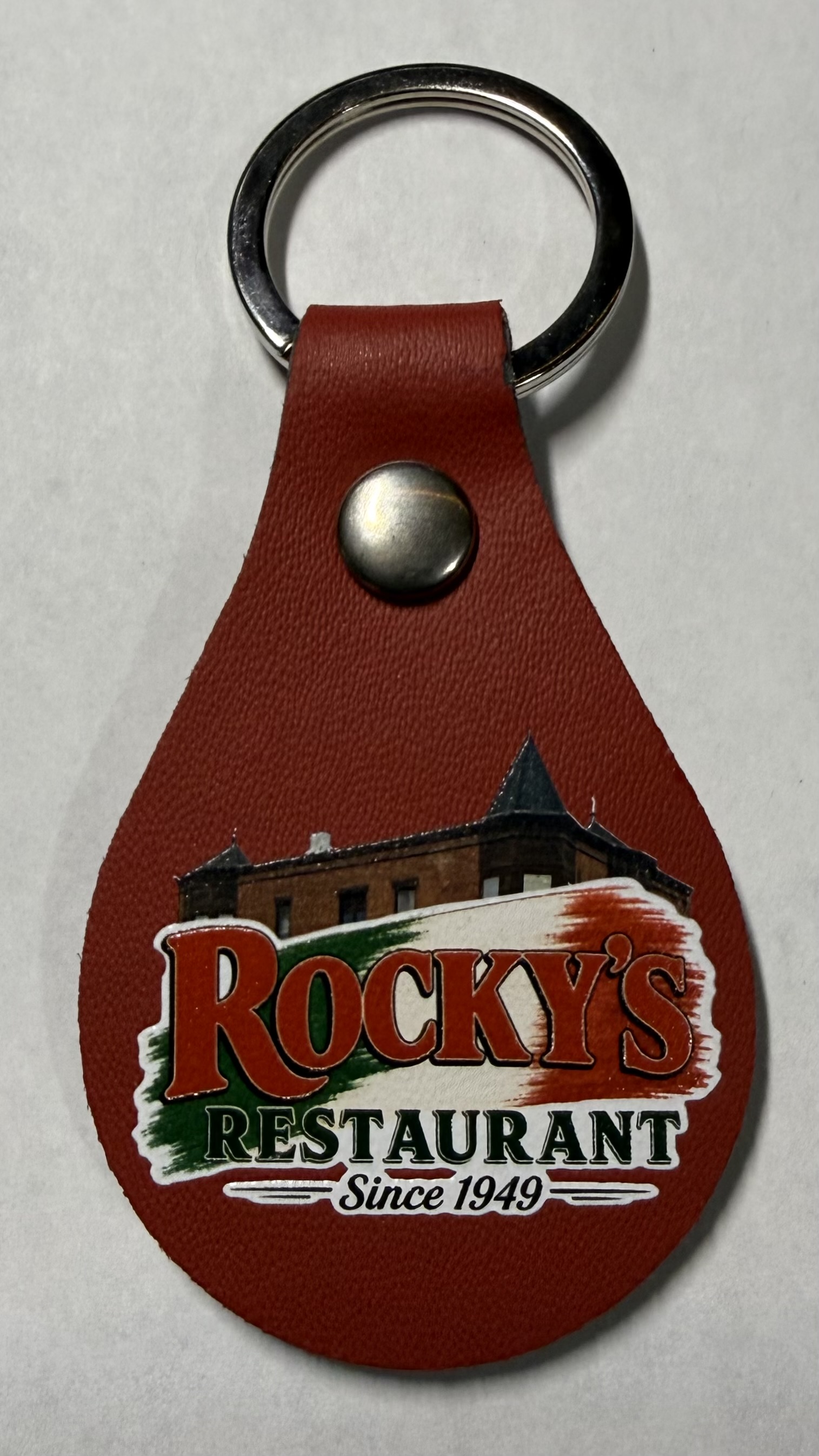 Rocky's Restaurant logo printed on a red keychain